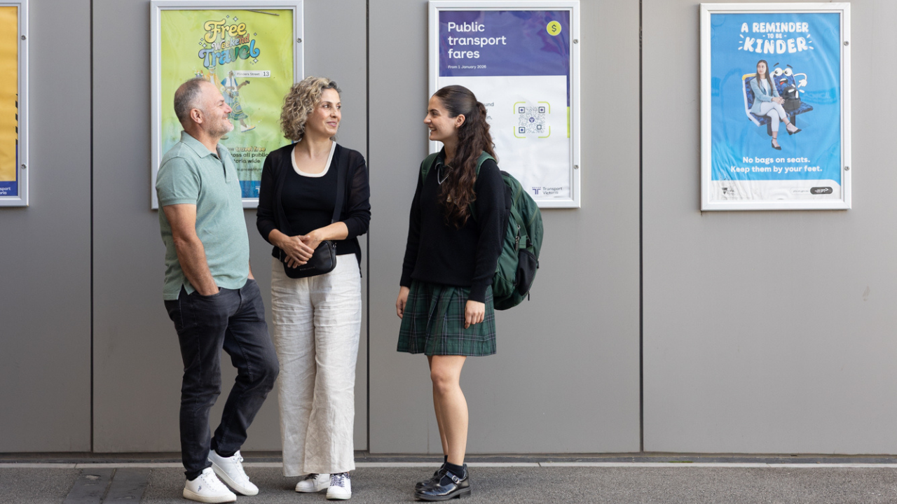 A family standing at a train station